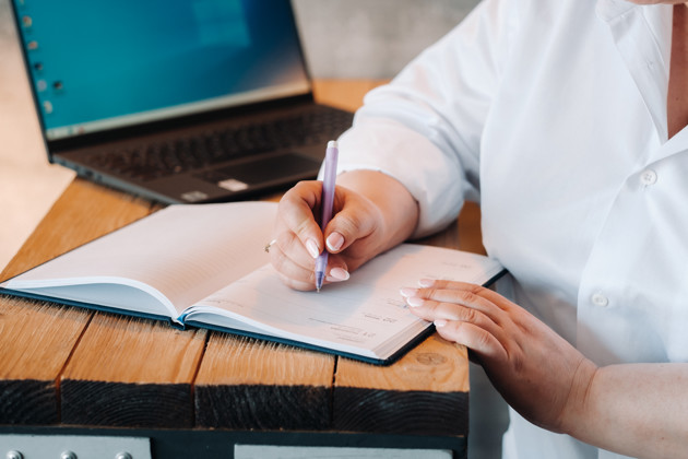 A Businesswoman In A White Shirt Sits At A Desk Wr 2023 11 27 05 32 37 Utc