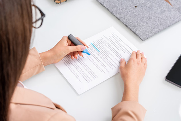 Young Brunette Businesswoman Underlining Text